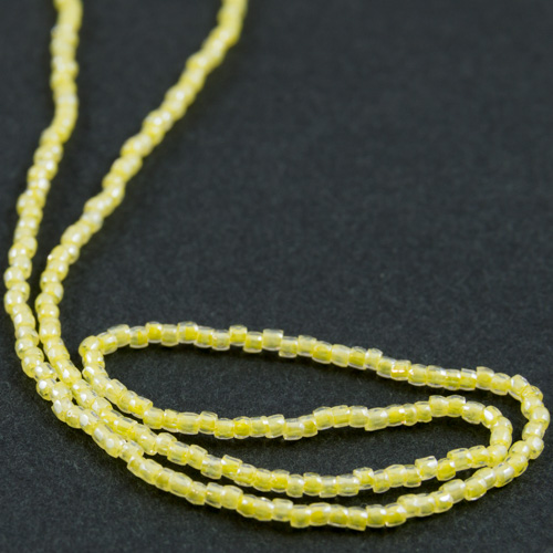 0161 12/0 3-cut bead transparent with yellow core